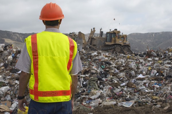 Site operator monitoring landfill odour control performance to meet environmental compliance standards