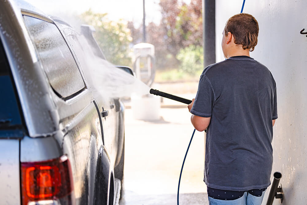 guy washing his car