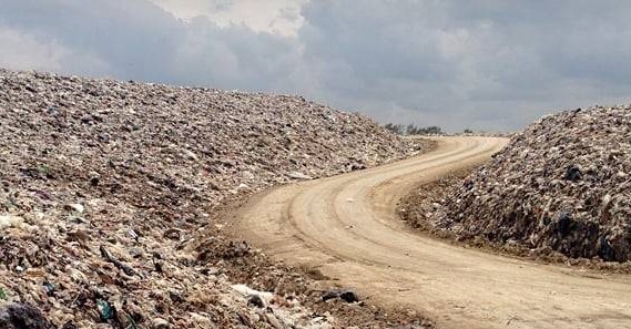Odour control at a landfill site, showing waste mounds and managed pathways to minimise odorous gas release.